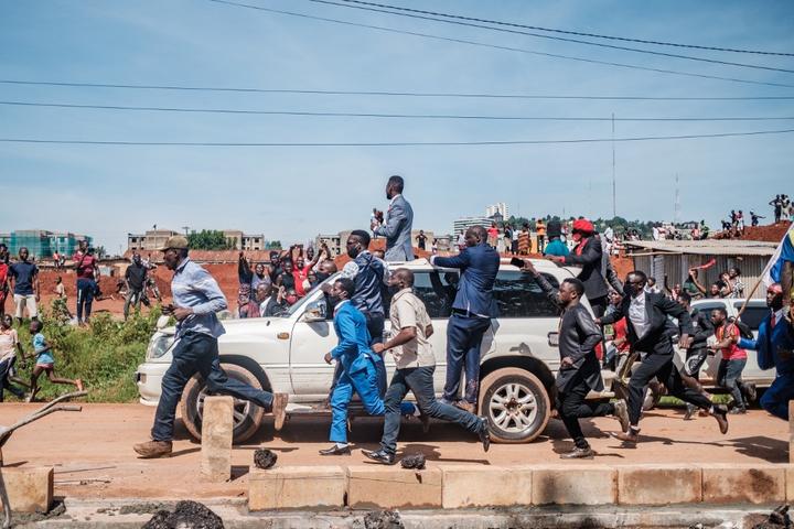 Musician turned politician Robert Kyagulanyi (C top), also known as Bobi Wine, greets supporters as he makes his way to be officially nominated as presidential candidate, in Kampala, Uganda.
