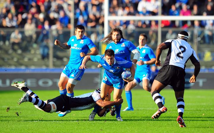 Italy's Luca Morisi is tackled by Fiji's Nemani Nadolo during their 2013 test in Cremona.