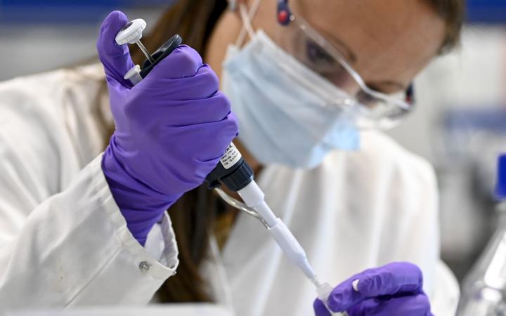 A laboratory analyst is at work at the headquarters of the "Janssen Pharmaceutica" pharmaceutical company in Beerse,on June 17, 2020. 