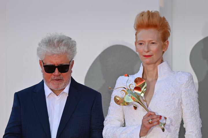 Spanish director Pedro Almodovar and British actress Tilda Swinton arrive for the screening of the film "The Human Voice" presented out of competition on the second day of the 77th Venice Film Festival. 