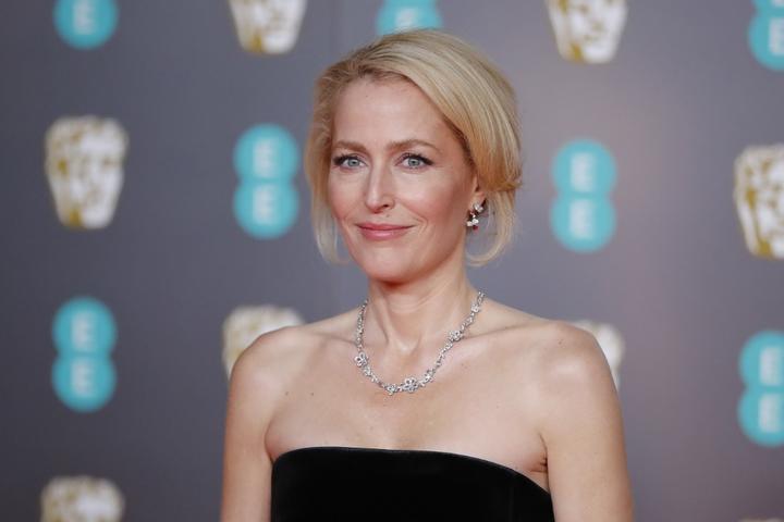 US actress Gillian Anderson poses on the red carpet upon arrival at the BAFTA British Academy Film Awards at the Royal Albert Hall in London on February 2, 2020. (Photo by Tolga AKMEN / AFP)