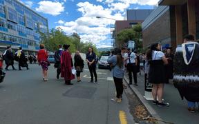 The procession dissipating after news the graduation ceremony was being postponed.
