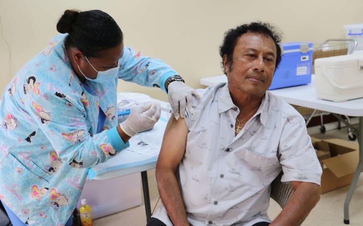 Palau's outgoing president, Tommy Remengesau, receives his Covid-19 vaccination. 
