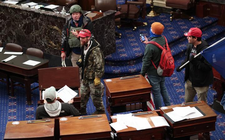 Protesters enter the Senate Chamber on January 06, 2021 in Washington, DC.