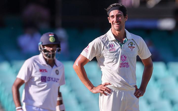 Australia's Mitchell Starc reacts after a delivery during the fifth day of the third cricket Test match between Australia and India at the Sydney Cricket Ground (SCG) in Sydney on January 11, 2021.