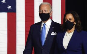 Democratic presidential nominee and former US Vice President Joe Biden (L) and vice presidential running mate, US Senator Kamala Harris, arrive to conduct their first press conference together in Wilmington, Delaware, on August 12, 2020. 