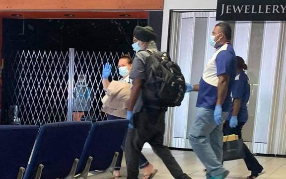 Professor Pal Ahluwalia and wife Sandy board flight to Brisbane