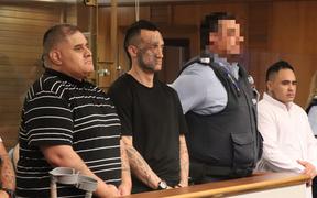 Steven Kingi (left), Jessee Burns (centre) and Stewart Hubbard (right of the guard) are heading to jail after pleading guilty to manslaughter and robbery.