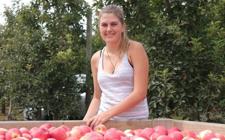 Hawke's Bay apple picker Olivia Winstone moved from Auckland to get out of the 'office environment'.