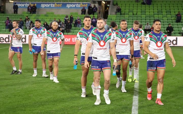 Warriors players look dejected after the round seven Anzac Day NRL match against the Melbourne Storm at AAMI Park on Sunday April 25, 2021 in Melbourne, Australia. 