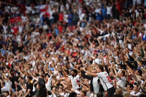 England supporters celebrate their win in the UEFA EURO 2020 round of 16 football match between England and Germany at Wembley Stadium in London on June 29, 2021. 