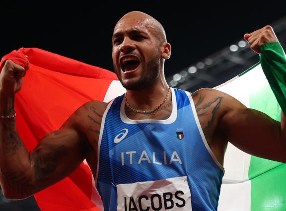 Lamont Marcell Jacobs of Italy reacts after winning Athletics men's 100m in Tokyo Olympic Games at Olympic Stadium in Tokyo on 1 August 2021. 