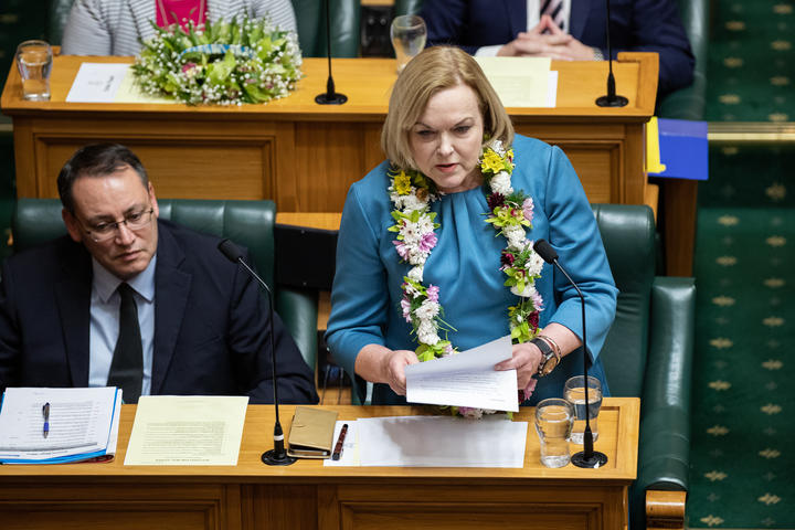 Leader of the Opposition, Judith Collins asks a question while wearing a Cook Island lei