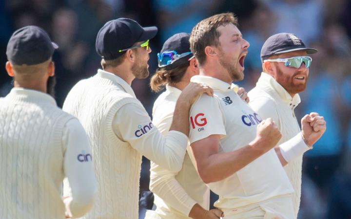 England's Ollie Robinson celebrates the wicket of India's Virat Kohli.