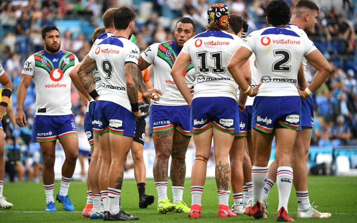 Warriors players look on after a Titans try during the Round 25 NRL match between the Gold Coast Titans and New Zealand Warriors at CBus Stadium on the Gold Coast, Sunday, September 5, 2021.
