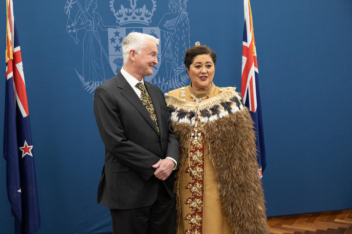 Dame Cindy Kiro poses with her husband Dr Richard Davies after the swearing in. She is wearing a Kahu Kiwi (a prestige kākahu adorned with kiwi feathers).
