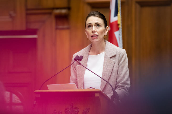 Jacinda Ardern, seen through the audience, introduces Dame Cindy Kiro. "...It was Dame Cindy’s compassion, knowledge and focus that stood out to me. She was passionate about what she was doing then and she has remained so in every single endeavour and every act of service."