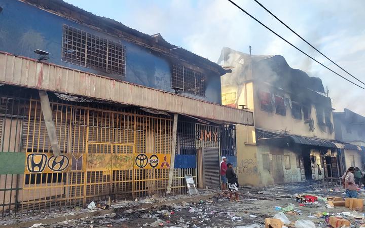 Chinatown in Honiara, where some buildings still are burning