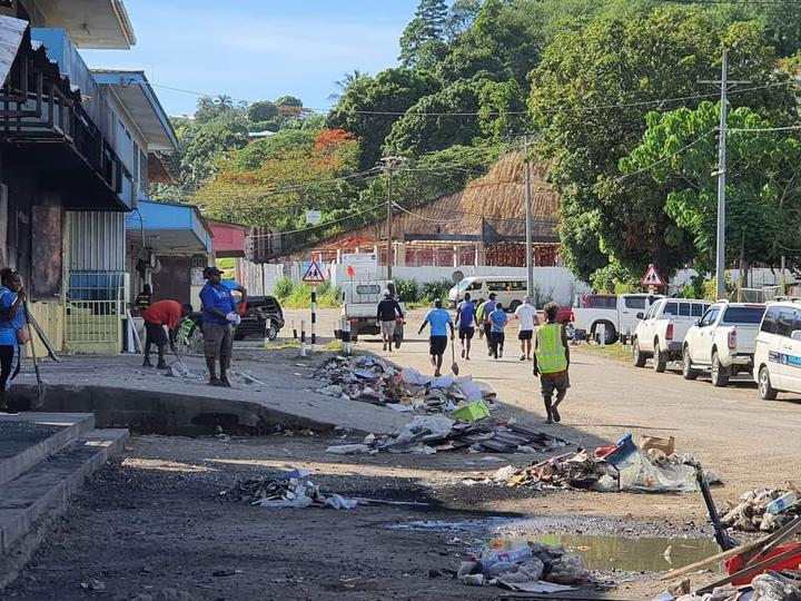 Cleaning up after the rioting in Honiara
