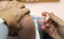 A woman receives an HPV vaccination