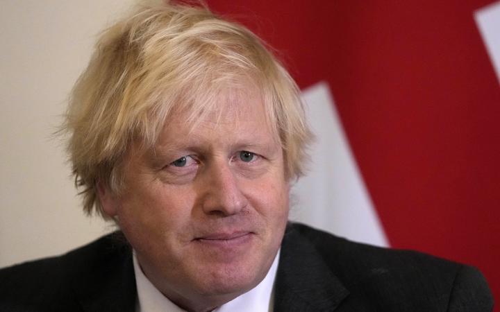 Britain's Prime Minister Boris Johnson looks on as he welcomes Oman's Sultan Haitham bin Tariq for talks in 10 Downing Street in London on December 16, 2021. (