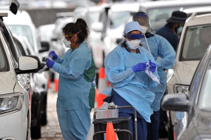 Health workers conduct PCR tests at the St Vincent's Bondi Beach Covid-19 drive through testing clinic on 22 December.