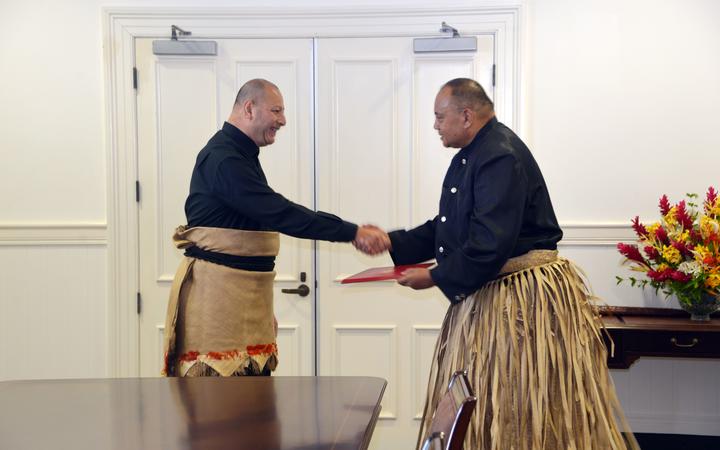 King Tupou VI receives the new Prime Minister of Tonga, Siaosi Sovaleni, after presenting the Royal Warrant of Appointment as Prime Minister at the Nuku'alofa Royal Palace on Tuesday, December 28, 2021. Sovaleni was elected Prime Minister by the new parliament, following Tonga's general vote on November 18 election.