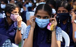 India, Chennai, 2022-01-03. A schoolgirl wears a mask during the vaccination camp at a school in Chennai. 
