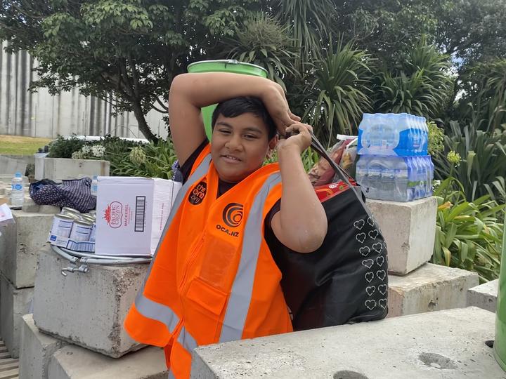 10-year-old Dempsey Taukeiaho helping with donations for the Tonga Tsunami relief effort