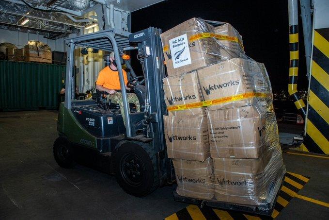 Supplies are loaded onboard the HMNZS Canterbury for Tonga's relief effort. 