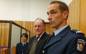 Stewart Murray Wilson (centre) at the Whanganui District Court in 2014.