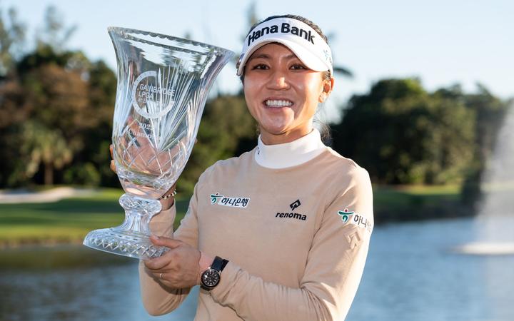 Lydia Ko holds the tournament trophy after winning the Gainbridge LPGA 2022.