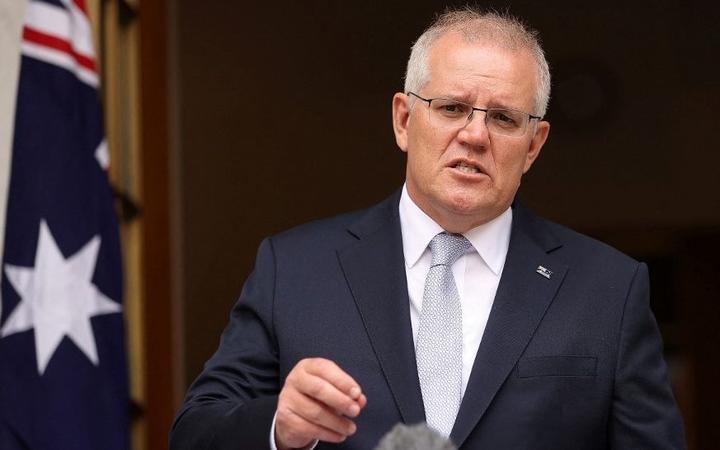 Australian Prime Minister Scott Morrison speaks to the media during a press conference at Parliament House in Canberra on January 6, 2022. (Photo by STRINGER / NO BYELINE / AFP)