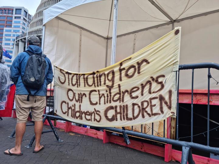 A sign at the protest camp at Parliament. 