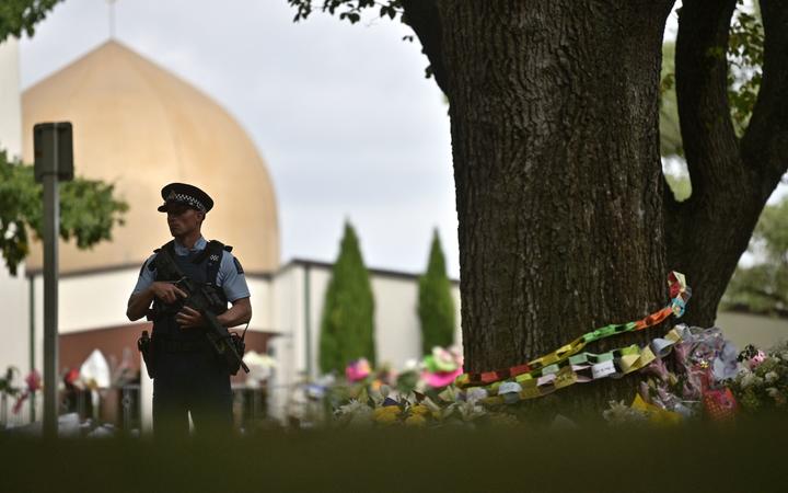 A policeman patrols as delegates and religious leaders wait to enter Al Noor Mosque in Christchurch on March 23, 2019, eight days after a shooting incident claimed the lives of 50 people in two mosques of the city. 