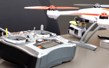 A small drone is controlled by remote.