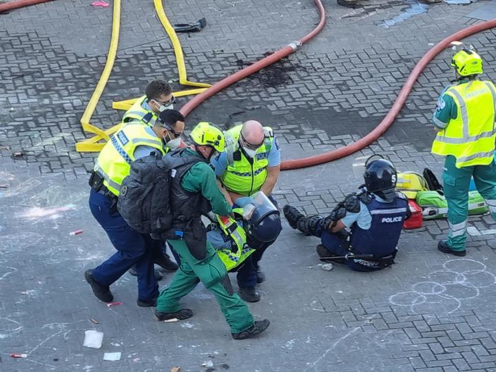 Several police appear to be injured.
