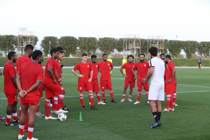 New Caledonia's players listen in during training in Qatar.