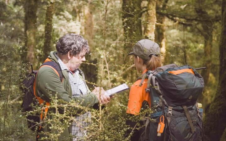 DOC bird counters Colin O’Donnell and Hannah Morris in the Landsborough Valley on the West Coast.