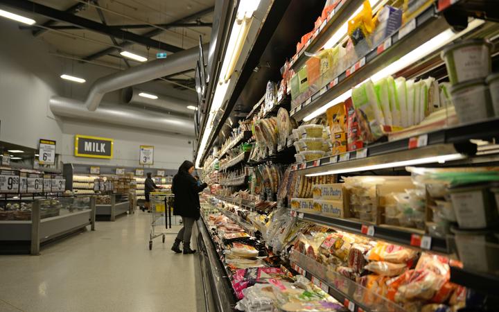 NELSON, NEW ZEALAND, JULY 19, 2018: Unidentified customers examine sale goods in a supermarket.