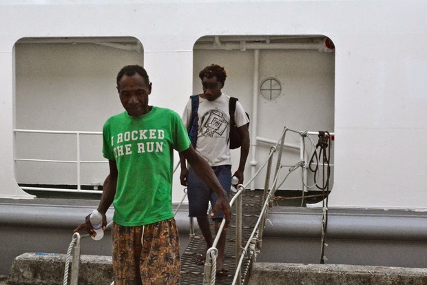 Michael Bolong and Ambros Wavut disembark the Yap Seagull in Pohnpei, FSM, Micronesia