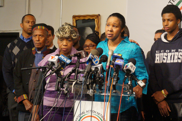 Eric Garner's widow, Esaw Garner (front right) rejected the police officer's apology.
