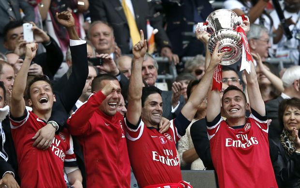 Arsenal players celebrate their FA Cup win.