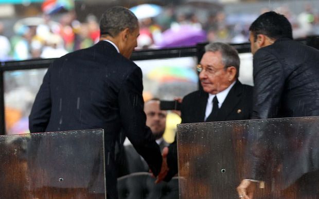 President Obama greets Cuban President Raul Castro last year, at a memorial service for the late South African President Nelson Mandela.