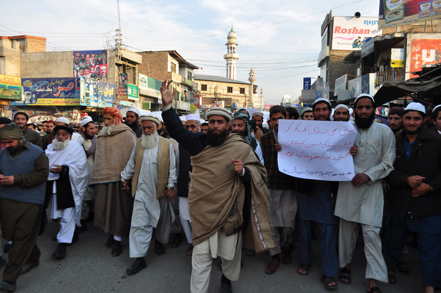Pakistani Islamists march for the victims of the Peshawar school massacre at a protest in Mansahra.
