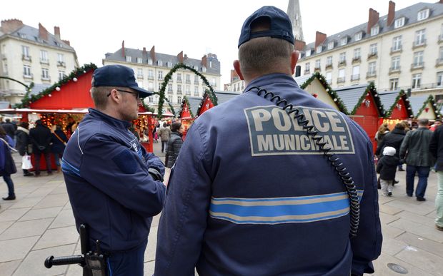 Police patrol the Christmas market in  Nantes a day after a man rammed shoppers with his van.