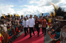 President Joko Widodo is welcomed to Jayapura, the capital of Papua