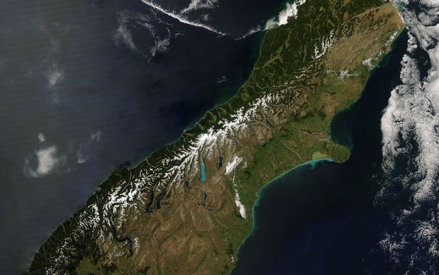 The Alpine Fault is marked out on satellite images by the western edge of the Southern Alps snowline.