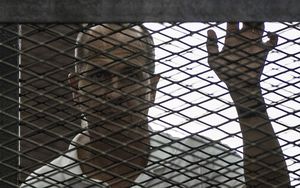 Al-Jazeera news channel's Australian journalist Peter Greste listens to the original court verdict in June.