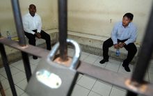 Myuran Sukumaran (L) and Andrew Chan (R) wait inside a detention room in Bali.